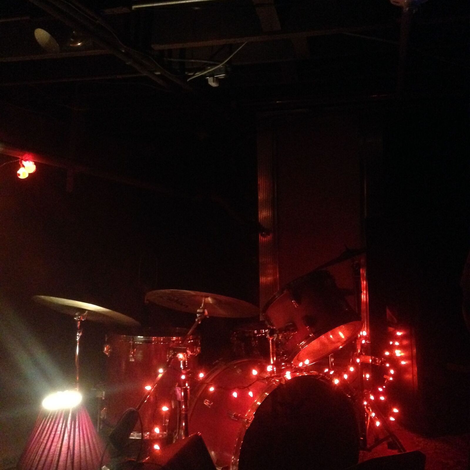 Drum kit with red lights, first show