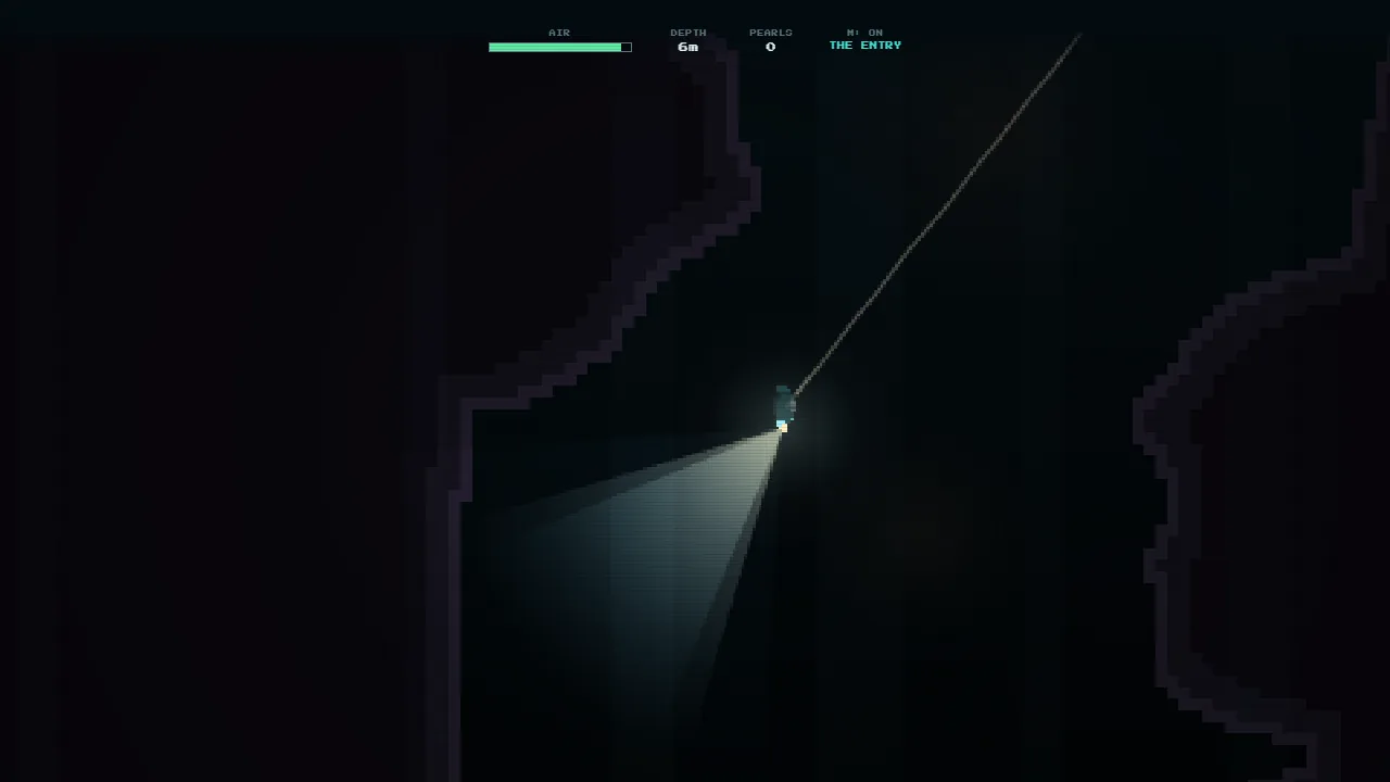 A dive under way: the diver on a long line from the surface, the lamp lighting a sliver of rock wall in the dark, the air gauge and depth at the top