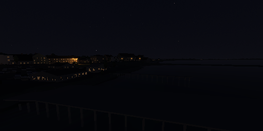 The same town after dark, a line of lit windows and street lamps along the shore under a near-black sky with faint stars